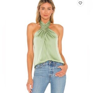 Pretty halter top with crisis cross neckline. Perfect with denim for date night.